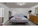Bright bedroom with a comfortable bed, a dresser, and a closet for ample storage at 340 Pheasant Dr, Haines City, FL 33844