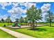 Community playground with slides and green surroundings for fun and outdoor activity at 340 Pheasant Dr, Haines City, FL 33844