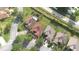 Aerial view showing the house in a neighborhood setting with mature trees at 340 Sorrento Rd, Kissimmee, FL 34759