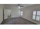 Bedroom with fan, shuttered windows, gray carpet and neutral wall color at 340 Sorrento Rd, Kissimmee, FL 34759