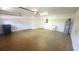 Clean, well-maintained garage with epoxy flooring, utility sink, and ample storage space at 340 Sorrento Rd, Kissimmee, FL 34759