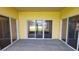 Spacious covered patio with sliding glass doors offering seamless indoor-outdoor living at 340 Sorrento Rd, Kissimmee, FL 34759