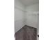 Carpeted walk-in closet featuring metal shelving and white walls at 340 Sorrento Rd, Kissimmee, FL 34759