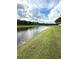 A serene lake view from the well-maintained backyard, blending natural beauty with comfortable living at 3539 Maple Ridge Loop, Kissimmee, FL 34741