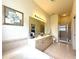 Well-lit bathroom featuring a double sink vanity, shower, and soaking tub at 3539 Maple Ridge Loop, Kissimmee, FL 34741