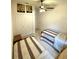 Bedroom featuring twin beds, carpet, and double door closet at 3539 Maple Ridge Loop, Kissimmee, FL 34741