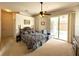 Spacious bedroom with a ceiling fan and access to the screened in lanai at 3539 Maple Ridge Loop, Kissimmee, FL 34741