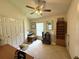 Versatile bedroom with desk and ceiling fan, offering comfort and functionality at 3539 Maple Ridge Loop, Kissimmee, FL 34741