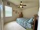 Cozy bedroom features a ceiling fan, neutral walls and comfortable bedding for relaxation and rest at 3539 Maple Ridge Loop, Kissimmee, FL 34741