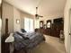 Spacious main bedroom features a ceiling fan, walk in closet, and lanai access at 3539 Maple Ridge Loop, Kissimmee, FL 34741