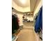 Walk-in closet with ample shelving and storage space, perfect for organizing your wardrobe at 3539 Maple Ridge Loop, Kissimmee, FL 34741