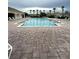 Enjoy the community pool with brick pavers, plenty of seating, and relaxing palm trees at 3539 Maple Ridge Loop, Kissimmee, FL 34741