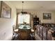 Cozy dining area next to living room, perfect for intimate meals at 3539 Maple Ridge Loop, Kissimmee, FL 34741