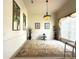 Spacious dining room with decorative lighting, neutral colors, and a large area rug at 3539 Maple Ridge Loop, Kissimmee, FL 34741
