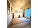 Formal dining room featuring a decorative rug, elegant lighting, and stylish decor at 3539 Maple Ridge Loop, Kissimmee, FL 34741