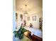 Bright dining room featuring a modern light fixture, floral arrangements, and decor at 3539 Maple Ridge Loop, Kissimmee, FL 34741