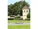 Community entrance sign featuring well maintained shrubbery at 3539 Maple Ridge Loop, Kissimmee, FL 34741