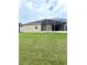 A nice lawn and screened in lanai on the back of this home at 3539 Maple Ridge Loop, Kissimmee, FL 34741