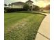 A home with mature landscaping and green lawn at 3539 Maple Ridge Loop, Kissimmee, FL 34741
