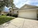 Charming single-Gathering home featuring a large two-car garage and well-maintained landscaping at 3539 Maple Ridge Loop, Kissimmee, FL 34741