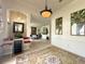 Inviting foyer with tile flooring, decorative rug, and entry to living room at 3539 Maple Ridge Loop, Kissimmee, FL 34741