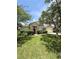 Attractive single-story home offering a neat lawn, charming front door, and shady trees at 3539 Maple Ridge Loop, Kissimmee, FL 34741