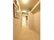 Hallway featuring tile floors and neutral colored walls and trim at 3539 Maple Ridge Loop, Kissimmee, FL 34741