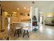 Open kitchen with breakfast bar and views of the living spaces at 3539 Maple Ridge Loop, Kissimmee, FL 34741