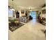 Open concept living area with tile floors, a dining table, and comfortable seating at 3539 Maple Ridge Loop, Kissimmee, FL 34741