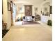Open living room with neutral carpet, a comfortable sofa, and decorative accents at 3539 Maple Ridge Loop, Kissimmee, FL 34741