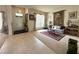 Open-concept living area with tile flooring, neutral carpet, and natural light at 3539 Maple Ridge Loop, Kissimmee, FL 34741