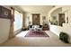 Cozy living room with neutral carpet, a decorative rug, and lots of natural light at 3539 Maple Ridge Loop, Kissimmee, FL 34741