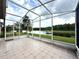 A screened-in lanai provides beautiful waterfront views and seamless indoor-outdoor living at 3539 Maple Ridge Loop, Kissimmee, FL 34741