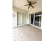 A comfortable tiled patio featuring a ceiling fan, ideal for relaxation and outdoor enjoyment at 3539 Maple Ridge Loop, Kissimmee, FL 34741