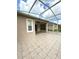 Tiled, screened patio with ceiling fan offers space for outdoor living and entertaining at 3539 Maple Ridge Loop, Kissimmee, FL 34741