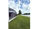 The screened-in lanai offers peaceful lakeside views and easy access to indoor living spaces at 3539 Maple Ridge Loop, Kissimmee, FL 34741