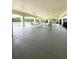 Community pool patio featuring covered seating area with tables and ceiling fans at 3539 Maple Ridge Loop, Kissimmee, FL 34741