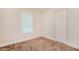 Neutral bedroom with new carpet, window, base trim and a closet at 4 Kasey Dr, Orlando, FL 32807