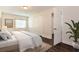 Bright bedroom featuring a closet, a view to the hallway, and a clean, minimalist design at 4 Kasey Dr, Orlando, FL 32807