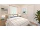 Well-lit bedroom with coordinated decor, a wooden headboard, and a serene ambiance at 4 Kasey Dr, Orlando, FL 32807