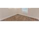 Bright bedroom featuring neutral walls and carpeted floor, complemented by a window for natural light at 4 Kasey Dr, Orlando, FL 32807