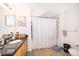 Clean bathroom with granite vanity, shower-tub combo, and practical layout at 4011 Venetian Bay Dr # 103, Kissimmee, FL 34741