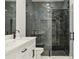 Close up on new bathroom featuring a glass shower and dual vanity at 42157 Tamarac St, Eustis, FL 32736