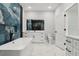 Bathroom featuring a soaking tub, stylish blue tiling, and a vanity with white countertops at 42157 Tamarac St, Eustis, FL 32736
