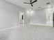 Large bedroom showing ensuite bathroom access, carpet flooring, and neutral paint at 42157 Tamarac St, Eustis, FL 32736