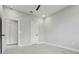 A new room with carpeting, a ceiling fan, and a doorway to a bathroom at 42157 Tamarac St, Eustis, FL 32736
