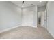 This is a spacious bedroom with neutral walls and carpet and a double-door closet at 42157 Tamarac St, Eustis, FL 32736