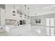 Bright kitchen featuring pendant lighting, stainless appliances, a central island, and marble floors at 42157 Tamarac St, Eustis, FL 32736