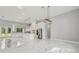 Open-concept living space featuring a kitchen with stainless steel appliances and marble flooring at 42157 Tamarac St, Eustis, FL 32736