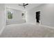 Spacious main bedroom with carpet floors, natural light, and an ensuite bathroom at 42157 Tamarac St, Eustis, FL 32736